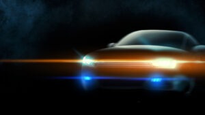 Graphic of a futuristic car with shining headlights