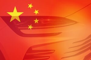 Chinese flag with a headlight of a car