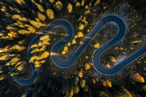 Aerial view of a winding road in the Dolomites, Italy.