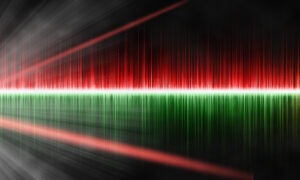 Sound waves with rays on a black background. Vibrant musical background with colour pulses of green and red. Bright sound waves.