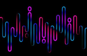 Glowing pink and blue neon lines resembling soundwaves or equalizer bars on a black background, creating a modern, tech-inspired abstract.