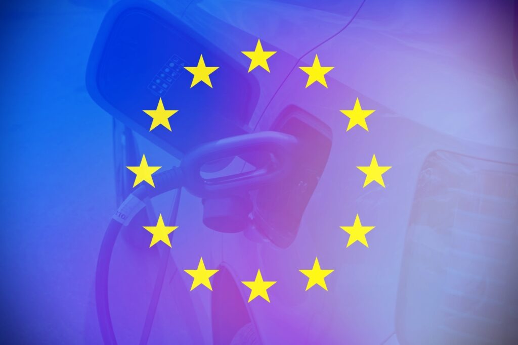 European flag with an electric car as background.