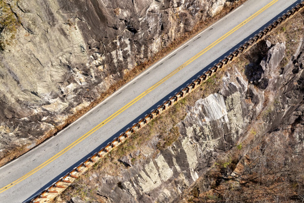 Winding Highlands Road offers a beautiful mountain pass experience in peak autumn season