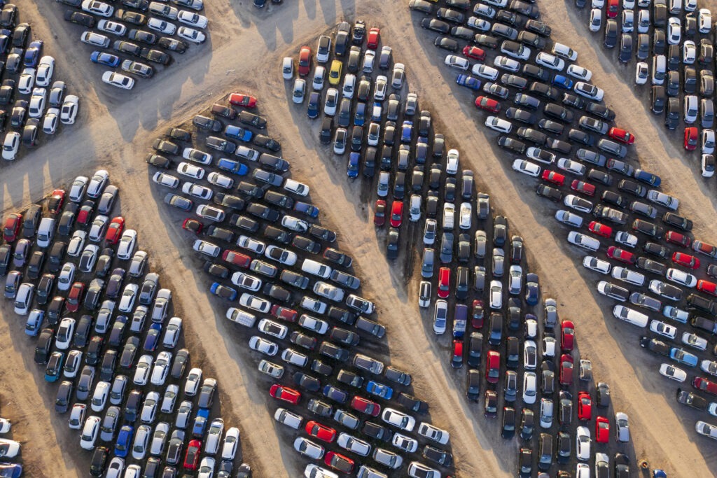 Aerial view of stockpiled used cars.