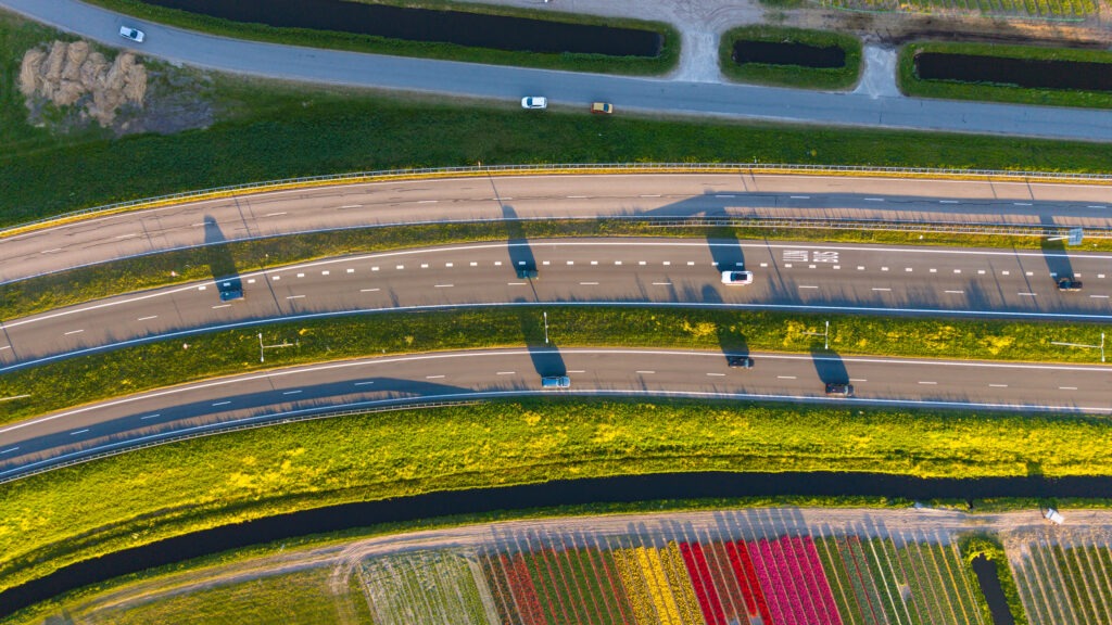 This is a drone photo of a highway through the countryside in the Netherlands
